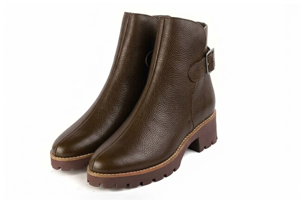 Women's dark brown back-buckle ankle boots with round toe and chunky rubber lug sole - Front view